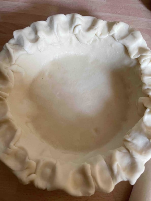 Fluted pie dough in pie dish
