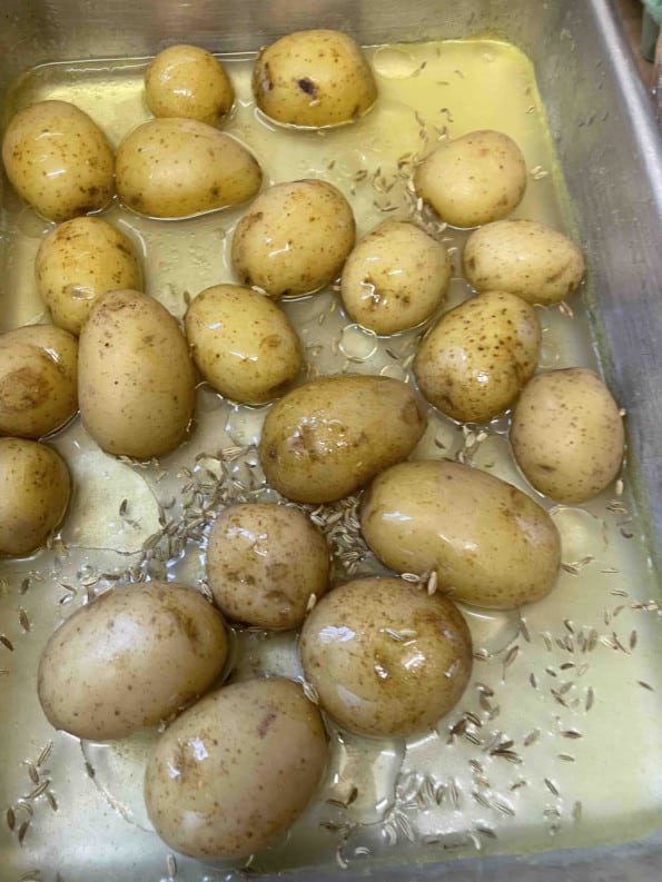 Potatoes in tin with stock