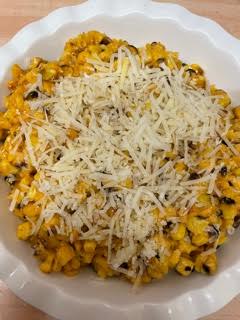 Creamed Corn in dish with Cheese on top