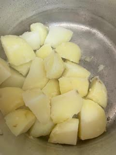 Potatoes after draining in pot
