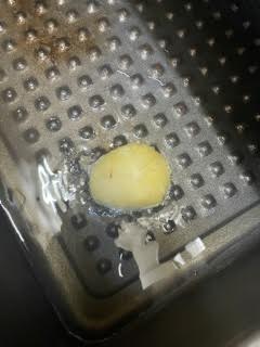 Single Potato added to hot Oil in tin