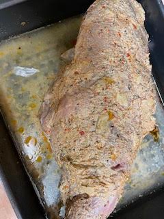 Lamb leg with marinade all over it