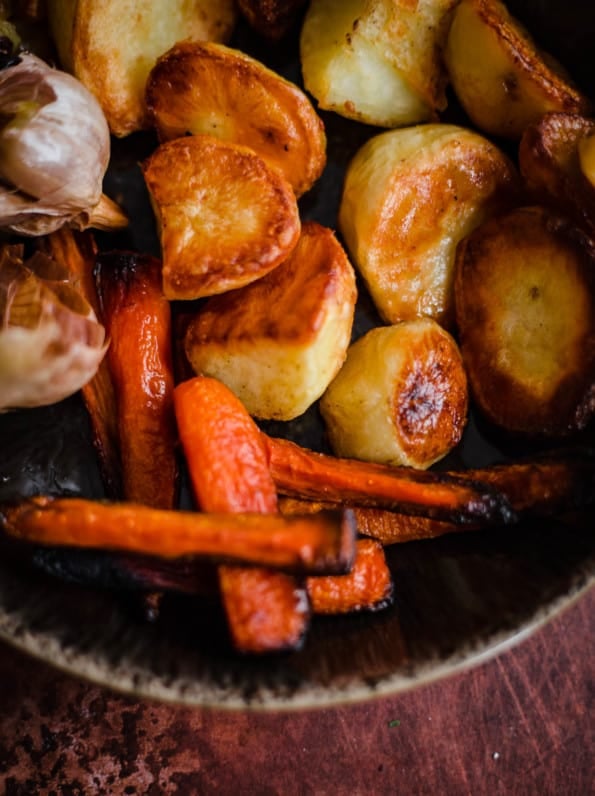 Roasted Potatoes and Carrots and Garlic in a bowl