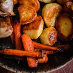 Roasted Potatoes and Carrots and Garlic in a bowl