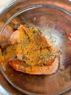 Chicken Tenders in a bowl with Spices