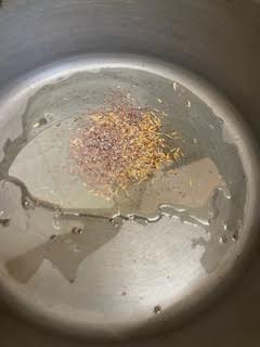 Cumin and Oil in pot