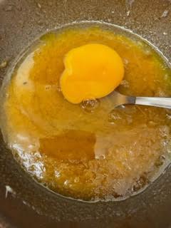 Egg being stirred into butter and sugar