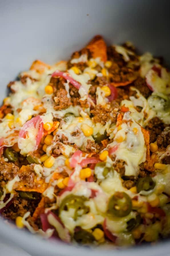 Nachos in air fryer with cheese, chilli and vegetables