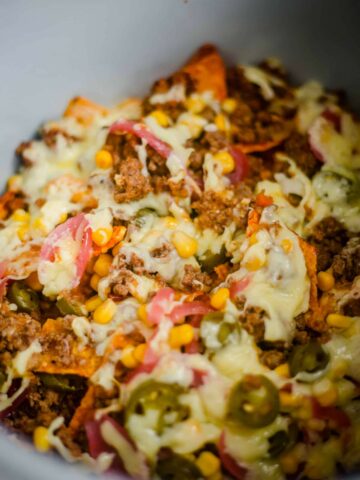 Nachos in air fryer with cheese, chilli and vegetables
