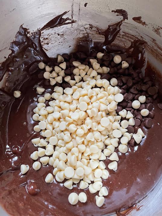 Chocolate chips added to batter in bowl