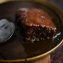Sticky toffee pudding in a plate with toffee sauce