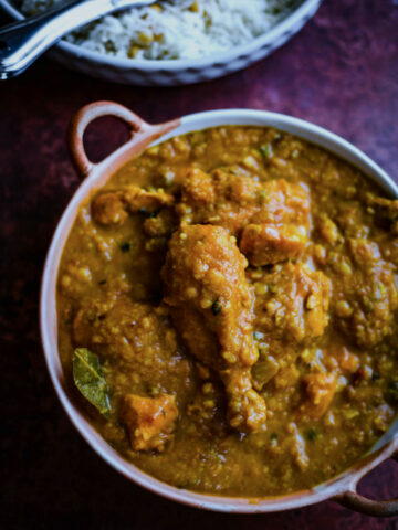 Chicken Dal Chawal in a dish with rice to the side