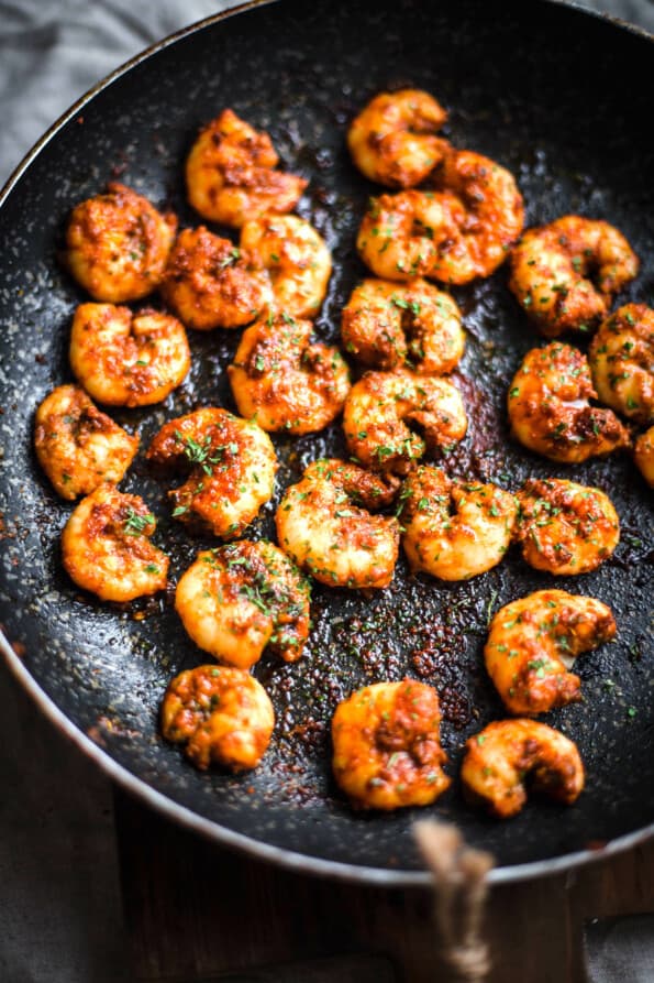 Shrimp in a pan on a wooden board