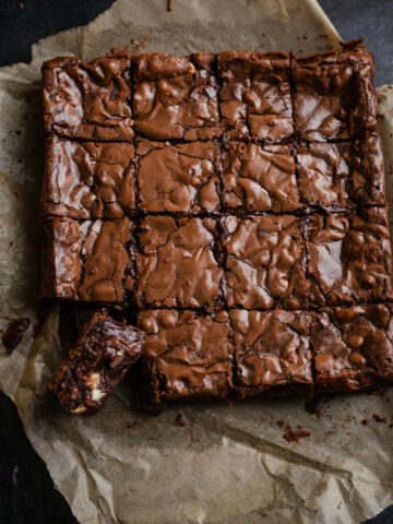 Chocolate brownies cut into pieces on baking paper