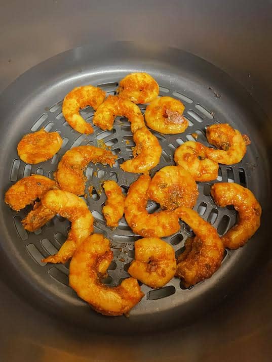 Marinaded shrimp in air fryer basket