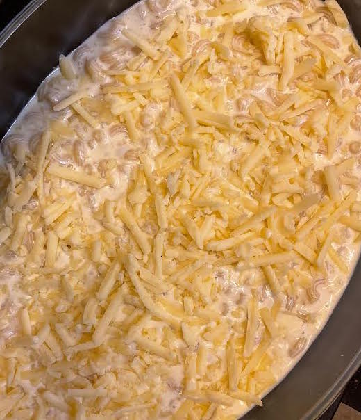 Grated Cheese added on top of Macaroni dish