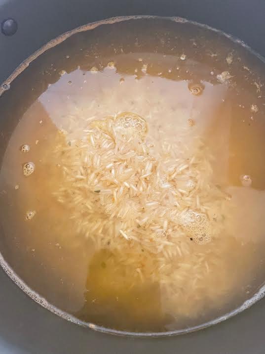 Rice and water in pot
