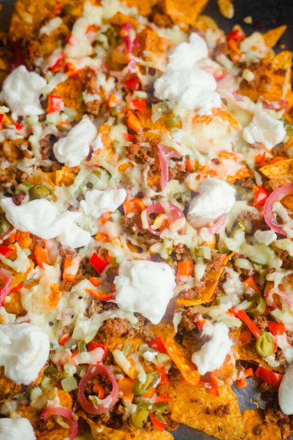 Nachos and toppings on a tray