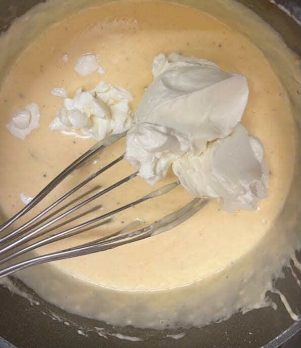 Cream cheese added to bechemel in pot