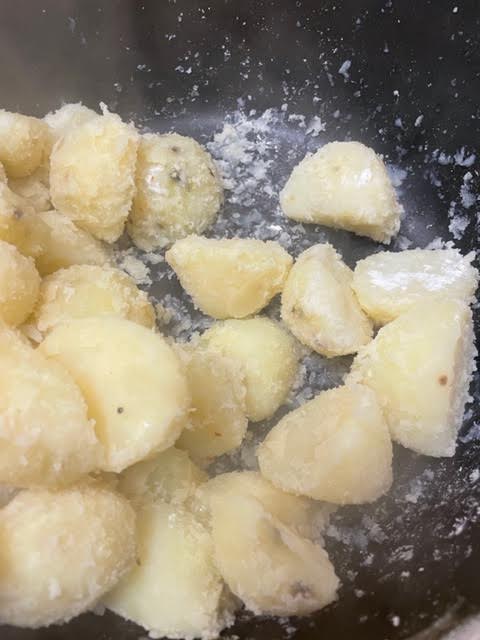 Steam dried potatoes in pot