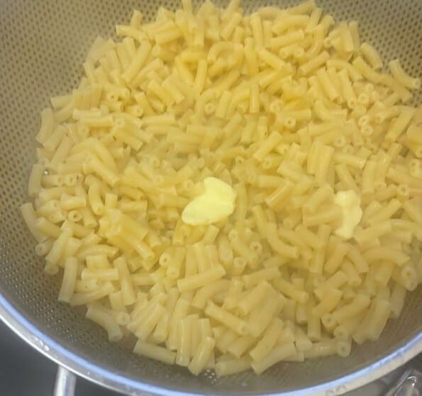 Pasta srained with a couple of tablespoons of butter on top