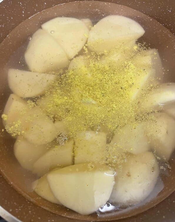 Potatoes and stock in pot