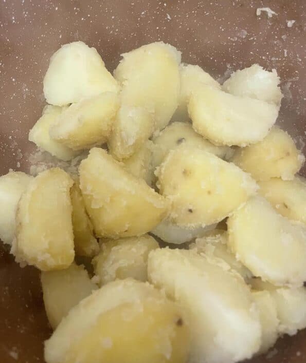 Steam dried potatoes in pot