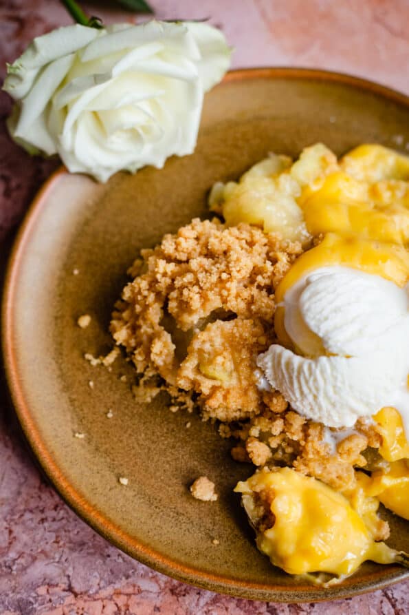 Pear crumble with ice cream in plate