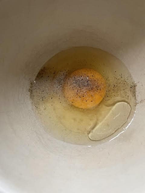 Egg, Oil, Salt and Pepper in bowl