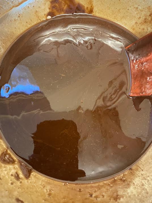 Chocolate and melted butter in bowl