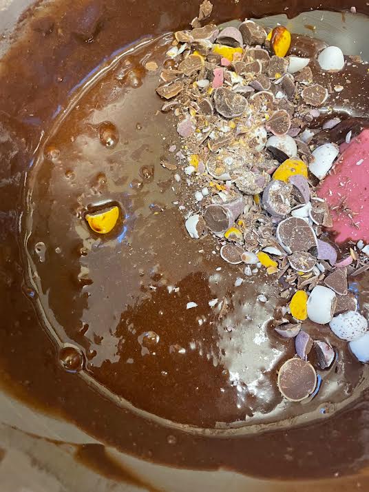 Mini eggs added to batter in stand mixer