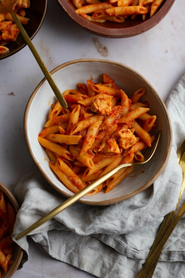 Penne Pomodoro in a bowl with a fork