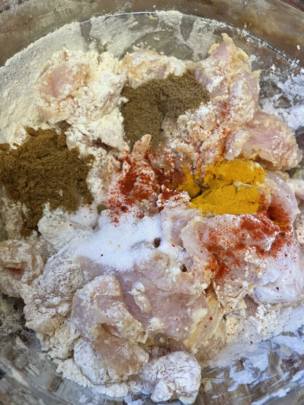 Spices added to chicken bowl