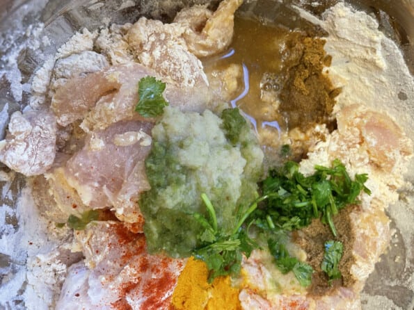 Water added to chicken bowl with spices