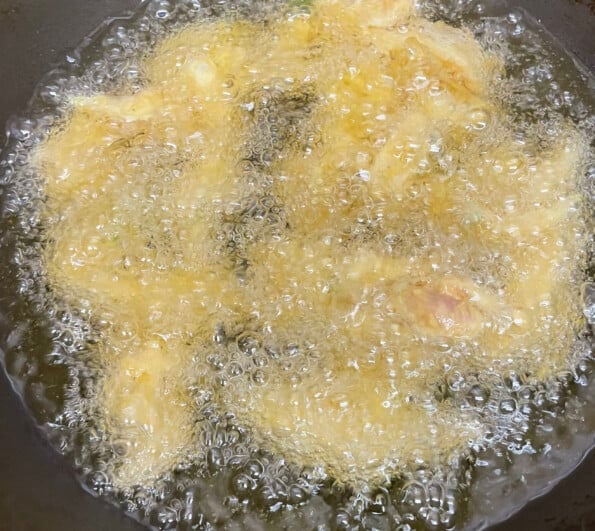 Chicken frying in oil