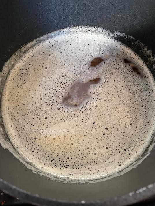 Browned butter with foam in pan