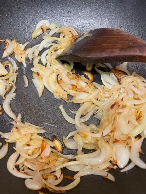 Browned onions in wok 