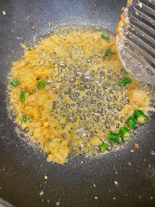 Garlic, Ginger and green chilli added to oil in wok