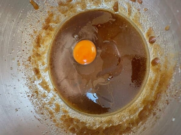 Egg added to batter in mixing bowl