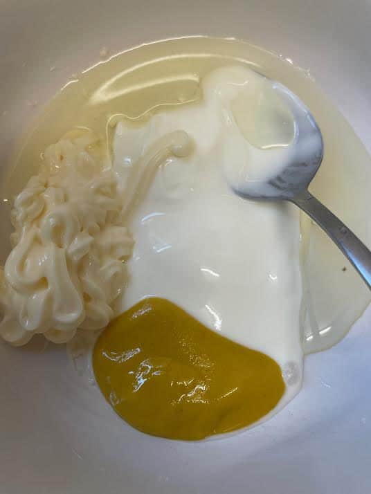 Yoghurt, mayonnaise and mustard in a bowl