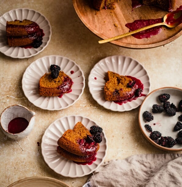 Pear and Blackberry Cake with slices in small plates