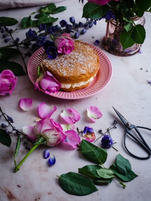 Cake with rose petals scattered around