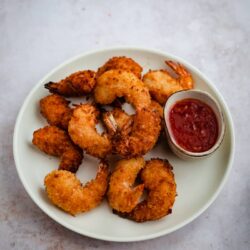 Coconut prawns with sweet chilli sauce in plate