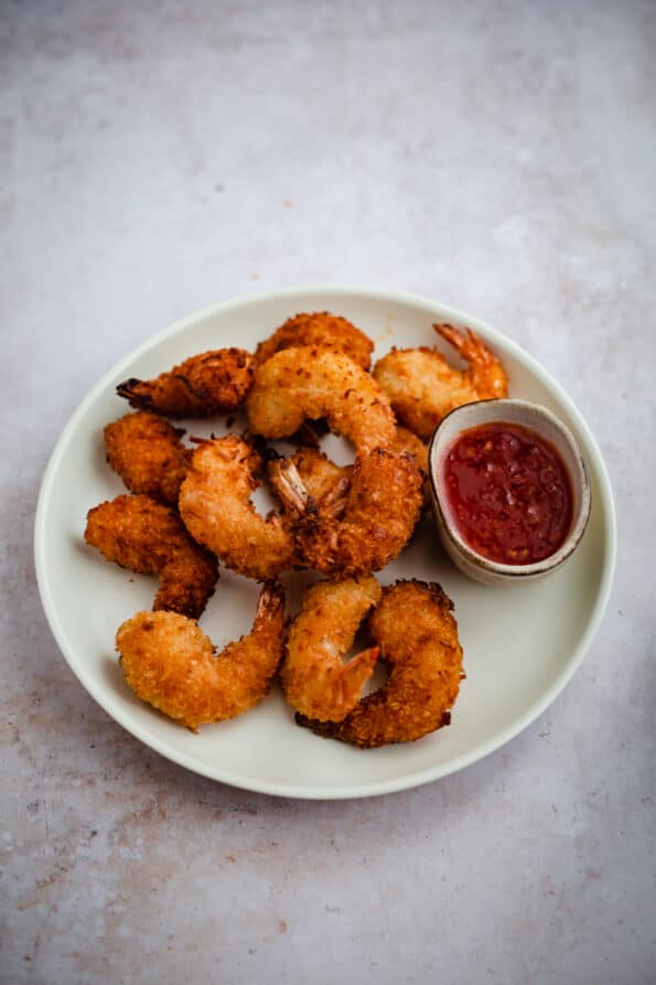 Coconut prawns with sweet chilli sauce in plate