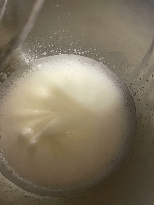 Beaten egg whites in a bowl