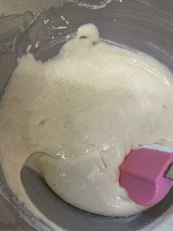 Flour mixed into yolk mixture in bowl