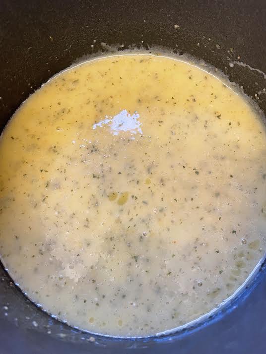 Melted garlic butter in pot