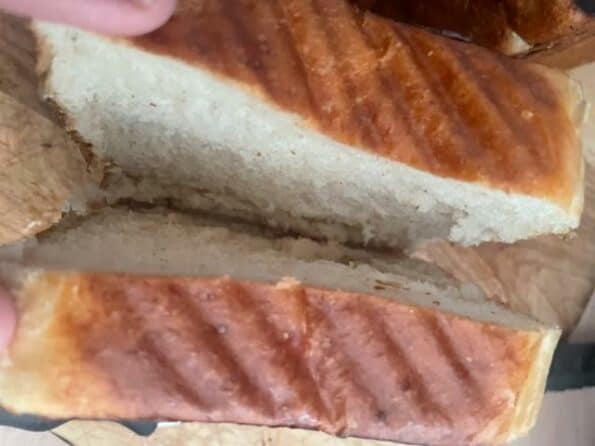 Bread open to reveal the pocket for beef, cheese and eggs