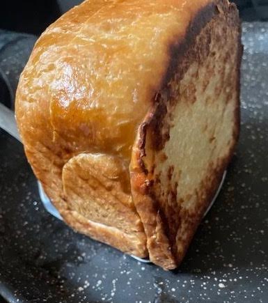 Slice of bread in pan standing up
