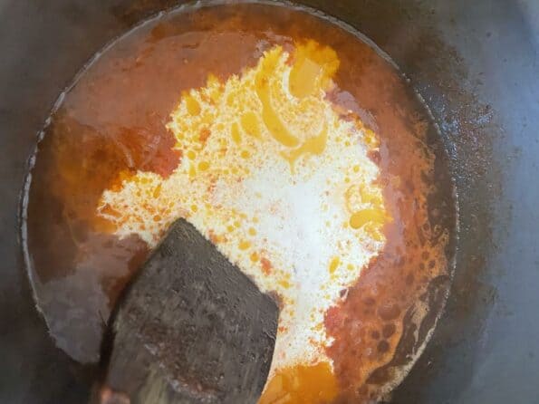 Cream stirred into pot